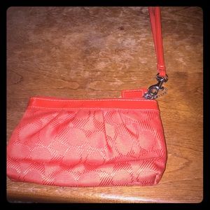 Coach wristlet, orange. Lightly used.